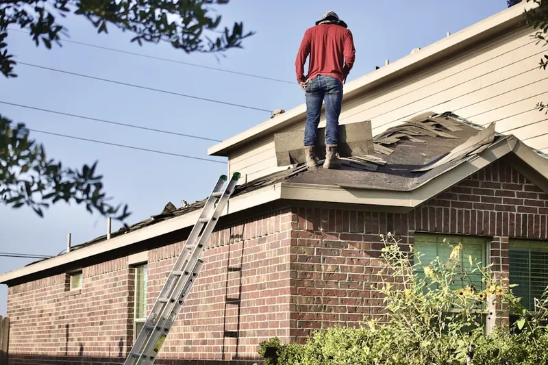 Professional roofer working on a residential roof in Pasadena